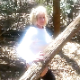 A pudgy, older blonde woman takes a chunky shit in a wooded, outdoor location while bending over with her ass to the camera. Over 1 minute.